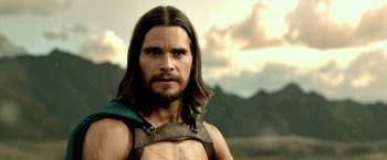 Movie still from “300: Rise of an Empire” (2014), directed by Noam Murro – A person with long brown hair; Close Up shot, Over the shoulder angle