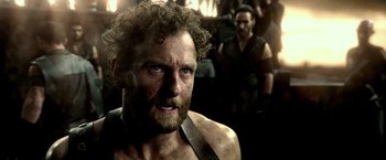 Movie still from “300: Rise of an Empire” (2014), directed by Noam Murro – A person with curly hair and a beard; Close Up shot, Over the shoulder angle