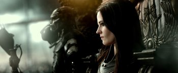 Movie still from “300: Rise of an Empire” (2014), directed by Noam Murro – A beautiful young lady wearing a leather jacket; Close Up shot, Over the shoulder angle