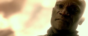 Movie still from “300: Rise of an Empire” (2014), directed by Noam Murro – A man's face in a black shirt; Close Up shot, Low angle