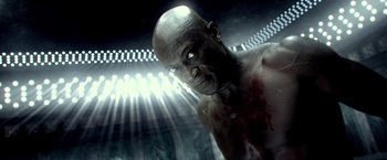 Movie still from “300: Rise of an Empire” (2014), directed by Noam Murro – A bald man with blood all over his face; Close Up shot, High angle