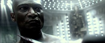 Movie still from “300: Rise of an Empire” (2014), directed by Noam Murro – A man's face in a room with lights; Extreme Close Up shot, High angle