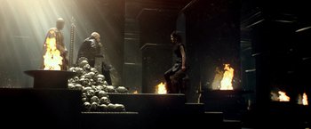 Movie still from “300: Rise of an Empire” (2014), directed by Noam Murro – A woman standing next to a pile of skulls; Wide shot, High angle