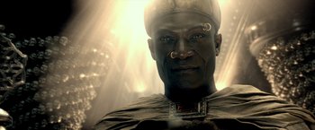 Movie still from “300: Rise of an Empire” (2014), directed by Noam Murro – A person wearing a hat and a necklace; Close Up shot, Overhead angle