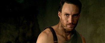 Movie still from “300: Rise of an Empire” (2014), directed by Noam Murro – A person wearing a tank top; Close Up shot, Over the shoulder angle