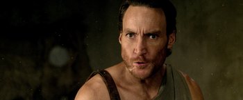 Movie still from “300: Rise of an Empire” (2014), directed by Noam Murro – A person wearing a tank top; Close Up shot, Over the shoulder angle