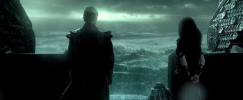 Movie still from “300: Rise of an Empire” (2014), directed by Noam Murro – A man standing in front of a body of water; Medium shot, Over the shoulder angle