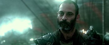 Movie still from “300: Rise of an Empire” (2014), directed by Noam Murro – A man with a beard is wearing armor; Close Up shot, Low angle