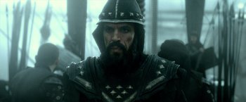 Movie still from “300: Rise of an Empire” (2014), directed by Noam Murro – A person wearing armor and a helmet; Close Up shot, Over the shoulder angle