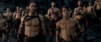Movie still from “300: Rise of an Empire” (2014), directed by Noam Murro – A group of men standing next to each other; Medium shot, Over the shoulder angle