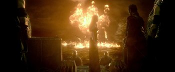 Movie still from “300: Rise of an Empire” (2014), directed by Noam Murro – A woman standing in front of an explosion in the ocean; Extreme Wide shot, High angle