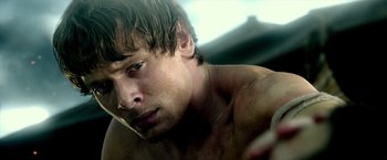 Movie still from “300: Rise of an Empire” (2014), directed by Noam Murro – A man's face and chest; Close Up shot, Over the shoulder angle