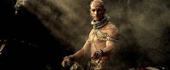 Movie still from “300: Rise of an Empire” (2014), directed by Noam Murro – A man in chains is standing in the fog; Medium shot, Low angle