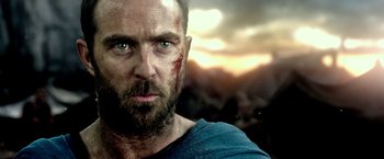 Movie still from “300: Rise of an Empire” (2014), directed by Noam Murro – A person with blood on his face; Close Up shot, Over the shoulder angle