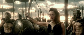 Movie still from “300: Rise of an Empire” (2014), directed by Noam Murro – A woman is holding a sword in front of a group of soldiers; Medium shot, Low angle