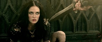 Movie still from “300: Rise of an Empire” (2014), directed by Noam Murro – A woman holding a large knife in her hand; Close Up shot, Low angle