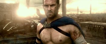 Movie still from “300: Rise of an Empire” (2014), directed by Noam Murro – A man with a scar on his face and chest; Medium shot, Low angle