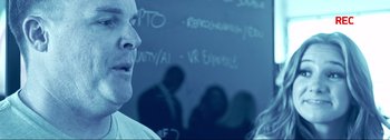 Movie still from “4 Days to End Cancer” (2022), directed by Christopher LaVoie – A man standing in front of a chalkboard; Close Up shot, Over the shoulder angle