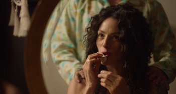 Movie still from “40 Years Young” (2022), directed by Pietro Loprieno – A woman brushing her teeth in front of a mirror; Close Up shot, Over the shoulder angle