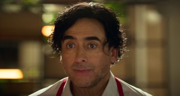 Movie still from “40 Years Young” (2022), directed by Pietro Loprieno – A person wearing an apron; Close Up shot, Low angle