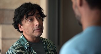 Movie still from “40 Years Young” (2022), directed by Pietro Loprieno – A person talking to another person; Close Up shot, Over the shoulder angle