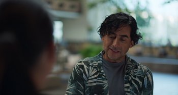 Movie still from “40 Years Young” (2022), directed by Pietro Loprieno – A person sitting in front of another person; Close Up shot, Over the shoulder angle