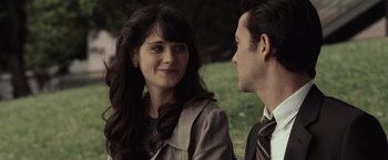 Movie still from “500 Days of Summer” (2009), directed by Marc Webb – A man and a woman sitting next to each other in a park; Close Up shot, Over the shoulder angle