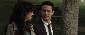 Movie still from “500 Days of Summer” (2009), directed by Marc Webb – A man and a woman standing next to each other in a park; Close Up shot, Over the shoulder angle