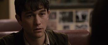 Movie still from “500 Days of Summer” (2009), directed by Marc Webb – A person sitting in a room; Close Up shot, Over the shoulder angle