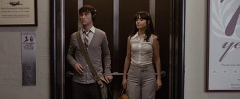 Movie still from “500 Days of Summer” (2009), directed by Marc Webb – A man and a woman standing next to each other; Medium shot, Low angle