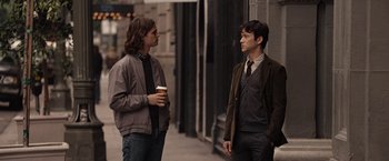Movie still from “500 Days of Summer” (2009), directed by Marc Webb – Two young men standing next to each other on the sidewalk; Medium shot, Over the shoulder angle