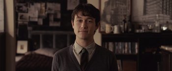 Movie still from “500 Days of Summer” (2009), directed by Marc Webb – A young man in a sweater and a tie; Close Up shot, Over the shoulder angle