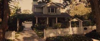 Movie still from “500 Days of Summer” (2009), directed by Marc Webb – A house that has a white picket fence in front of it; Extreme Wide shot, High angle