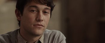 Movie still from “500 Days of Summer” (2009), directed by Marc Webb – A man's face with a serious look; Close Up shot, Over the shoulder angle