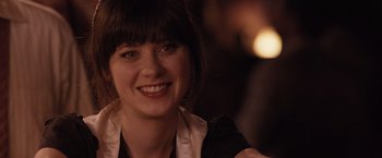 Movie still from “500 Days of Summer” (2009), directed by Marc Webb – A person smiling for the camera; Close Up shot, Over the shoulder angle