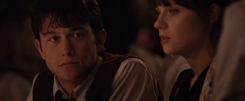 Movie still from “500 Days of Summer” (2009), directed by Marc Webb – A man and a woman sitting next to each other; Close Up shot, Over the shoulder angle
