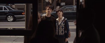 Movie still from “500 Days of Summer” (2009), directed by Marc Webb – A man and a woman standing next to each other on the street; Medium shot, Over the shoulder angle