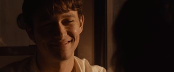 Movie still from “500 Days of Summer” (2009), directed by Marc Webb – A person smiling for the camera; Close Up shot, Over the shoulder angle