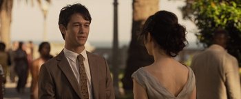 Movie still from “500 Days of Summer” (2009), directed by Marc Webb – A man and a woman standing next to each other in front of trees; Close Up shot, Over the shoulder angle