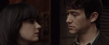 Movie still from “500 Days of Summer” (2009), directed by Marc Webb – A man and a woman looking at each other; Close Up shot, Over the shoulder angle