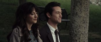 Movie still from “500 Days of Summer” (2009), directed by Marc Webb – A man and a woman are standing next to each other; Close Up shot, Over the shoulder angle