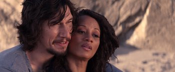 Movie still from “65” (2023), directed by Bryan Woods – A man and a woman are posing for a picture; Close Up shot, Over the shoulder angle