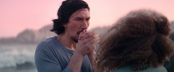 Movie still from “65” (2023), directed by Bryan Woods – A person holding their hands to their mouth; Close Up shot, Over the shoulder angle