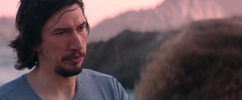 Movie still from “65” (2023), directed by Bryan Woods – A person with a mountain in the background; Close Up shot, Over the shoulder angle