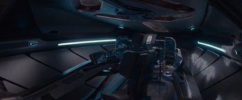 Movie still from “65” (2023), directed by Bryan Woods – A view of the inside of an airplane; Wide shot, High angle