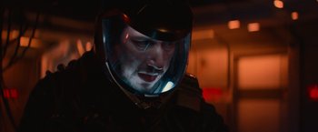 Movie still from “65” (2023), directed by Bryan Woods – A person wearing a helmet; Close Up shot, Over the shoulder angle