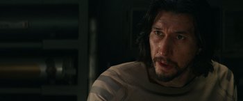 Movie still from “65” (2023), directed by Bryan Woods – A person with long black hair; Close Up shot, Over the shoulder angle