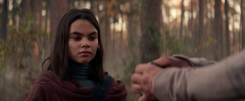 Movie still from “65” (2023), directed by Bryan Woods – A young girl in a scarf looking at an older man; Close Up shot, Over the shoulder angle