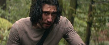 Movie still from “65” (2023), directed by Bryan Woods – A person with long black hair; Close Up shot, Low angle