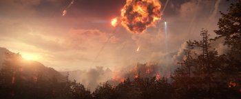 Movie still from “65” (2023), directed by Bryan Woods – A large fireball in the middle of a forest; Extreme Wide shot, Low angle